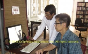 Archivist Sopheap Chea (l) assists Arthur Dong at the Bophana Audiovisual Resource Center, Phnom Penh. © 2013 DeepFocus Productions, Inc.